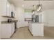 Modern kitchen with stainless steel appliances, granite countertops, island with seating, and pendant lighting at 11892 Frost Aster Dr, Riverview, FL 33579