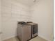 Well-organized laundry room with modern machines and ample shelving at 11892 Frost Aster Dr, Riverview, FL 33579