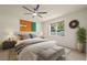 Inviting main bedroom features a ceiling fan, neutral decor, and a bright window at 11892 Frost Aster Dr, Riverview, FL 33579
