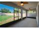 Enjoy indoor-outdoor living on this screened patio with ceiling fans and views of the private backyard at 11892 Frost Aster Dr, Riverview, FL 33579