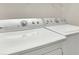 Bright laundry room with white washer and dryer included at 26549 Chimney Spire Ln, Wesley Chapel, FL 33544