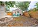 Fenced backyard featuring a charming seating area, offering a private and relaxing outdoor space at 440 22Nd N St, St Petersburg, FL 33713