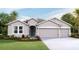 Two-story house with three-car garage and attractive landscaping at 10736 Tippecanoe Pl, Parrish, FL 34219