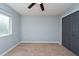 Spacious bedroom with double doors to closet and window at 18141 Sandy Pointe Dr, Tampa, FL 33647
