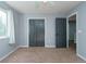 Spacious bedroom with carpeted floor, double doors closet and ceiling fan at 18141 Sandy Pointe Dr, Tampa, FL 33647
