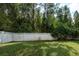 Private backyard with grassy area and privacy fence at 18141 Sandy Pointe Dr, Tampa, FL 33647