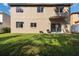 Large backyard with grassy area and privacy fence at 18141 Sandy Pointe Dr, Tampa, FL 33647
