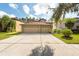 Two-story house with a three-car garage and spacious driveway at 18141 Sandy Pointe Dr, Tampa, FL 33647