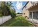 Landscaped backyard with grassy area and privacy fence at 18141 Sandy Pointe Dr, Tampa, FL 33647