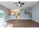 Open concept living room with kitchen and staircase visible at 18141 Sandy Pointe Dr, Tampa, FL 33647