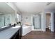 Bathroom features a soaking tub, double vanity, and shower at 18141 Sandy Pointe Dr, Tampa, FL 33647