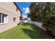 Landscaped backyard with grassy area and privacy fence at 18141 Sandy Pointe Dr, Tampa, FL 33647