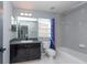 Clean bathroom with tub shower combo, vanity, and mirror at 18141 Sandy Pointe Dr, Tampa, FL 33647
