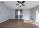 Living room with hardwood floors, neutral walls, and ceiling fan at 18141 Sandy Pointe Dr, Tampa, FL 33647