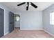 Well-lit bedroom with neutral walls and carpet at 18141 Sandy Pointe Dr, Tampa, FL 33647