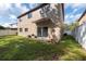 Spacious backyard with grassy area and privacy fence at 18141 Sandy Pointe Dr, Tampa, FL 33647