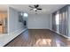 Spacious living room with wood-look floors and a view of the kitchen and staircase at 18141 Sandy Pointe Dr, Tampa, FL 33647