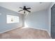 Bright bedroom featuring neutral walls and carpet at 18141 Sandy Pointe Dr, Tampa, FL 33647