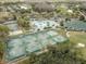 Community tennis courts with surrounding landscape at 18141 Sandy Pointe Dr, Tampa, FL 33647