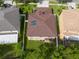 A house with solar panels on the roof, surrounded by trees at 18141 Sandy Pointe Dr, Tampa, FL 33647