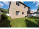Green backyard with grassy area and privacy fence at 18141 Sandy Pointe Dr, Tampa, FL 33647