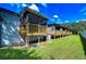 Backyard view showing multiple elevated decks and green lawn at 6320 92Nd N Pl # 2601, Pinellas Park, FL 33782