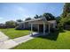 House exterior showcasing carport and landscaping at 710 W Braddock St, Tampa, FL 33603
