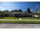House exterior with orange door and carport at 710 W Braddock St, Tampa, FL 33603