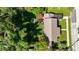 Home with large backyard and surrounding trees at 710 W Braddock St, Tampa, FL 33603