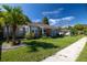 House exterior with palm trees and green lawn at 710 W Braddock St, Tampa, FL 33603