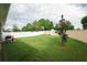 Private backyard with grassy area, privacy wall and landscaping at 11892 Frost Aster Dr, Riverview, FL 33579