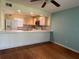 Open dining area with hardwood floors and kitchen views at 2625 State Road 590 # 2514, Clearwater, FL 33759