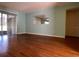 A simple living room with hardwood floors and light teal walls at 2625 State Road 590 # 2514, Clearwater, FL 33759