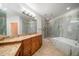 Bathroom features granite double vanity and soaking tub at 1030 Bellasol Way # 201, Apollo Beach, FL 33572