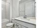 Bathroom featuring a tub-shower combination, toilet, and single sink vanity with quartz counters at 13715 Brookside Haven St, Riverview, FL 33578