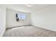 Light and airy bedroom with neutral carpet, window view, and lots of natural light at 13715 Brookside Haven St, Riverview, FL 33578