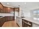 Spacious kitchen with an island, stainless steel appliances, and modern fixtures at 13715 Brookside Haven St, Riverview, FL 33578
