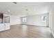 Spacious living area featuring hardwood floors, recessed lighting, and backyard views at 13715 Brookside Haven St, Riverview, FL 33578