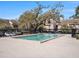 Outdoor community pool surrounded by concrete and black metal fencing at 5122 Puritan Cir, Tampa, FL 33617