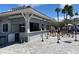 The open-air pool bar features ample counter space, tiled accents, and convenient roll-down doors at 657 Masterpiece Dr # 154, Sun City Center, FL 33573