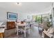 Charming dining area with white table and wooden buffet at 800 Cove Cay Dr # 3C, Clearwater, FL 33760