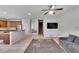 Open floor plan living room with L-shaped sofa and TV at 1905 Via Napoli St, Plant City, FL 33566