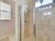 Shower stall with glass enclosure and beige tile at 1905 Via Napoli St, Plant City, FL 33566