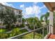Relaxing patio overlooking lush landscaping and a fountain at 1030 Bellasol Way # 201, Apollo Beach, FL 33572
