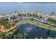 Aerial view of waterfront community with pond and lush landscaping at 5153 Isla Key S Blvd # 412, St Petersburg, FL 33715