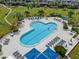 Refreshing community pool with surrounding lounge chairs at 5153 Isla Key S Blvd # 412, St Petersburg, FL 33715