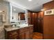 Bathroom with granite countertop, modern vanity, and walk-in shower at 5153 Isla Key S Blvd # 412, St Petersburg, FL 33715