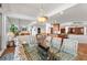 Bright dining room with glass top table and patterned chairs at 5153 Isla Key S Blvd # 412, St Petersburg, FL 33715