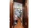Large pantry with wood cabinets offering significant storage space at 5153 Isla Key S Blvd # 412, St Petersburg, FL 33715