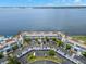 Aerial view of waterfront condo community with pool and parking at 5153 Isla Key S Blvd # 412, St Petersburg, FL 33715